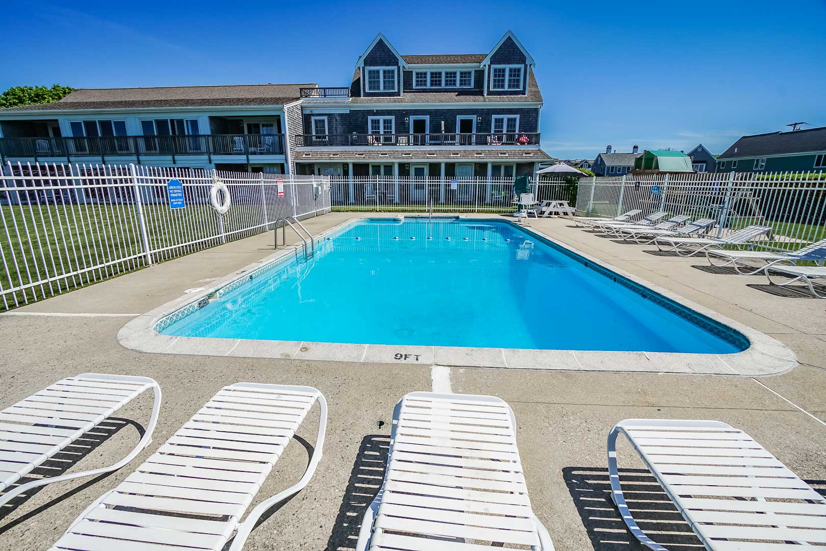 A refreshing pool view at VRI's Beachside Village Resort in Massachusetts.